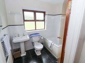 A bathroom with a toilet, sink, and bathtub at Brow O' The Hill in Ballyshannon