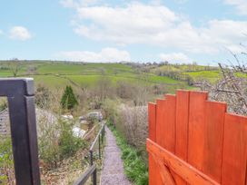 A view of a path leading down a hill through a gate at The Rhiw in Llanfair Caereinion