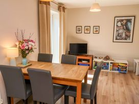 A dining room with a table and chairs at Driftwood in Filey