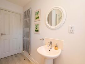 A bathroom with a sink and towel radiator at Driftwood in Filey