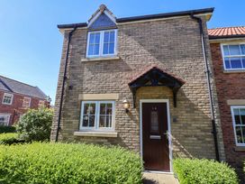 A house exterior featuring a front door and windows at Driftwood Filey