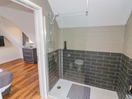 A bathroom with shower and toilet at The Coach House in Chacombe