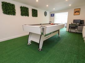 A snug with a pool table and dartboard at Castellolwg