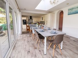 A dining room with a table set for dinner at Castellolwg
