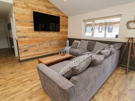 A living room featuring a sofa and coffee table at Barn Owl Otterburn