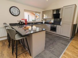 A kitchen with a sink and appliances at Barn Owl in Otterburn
