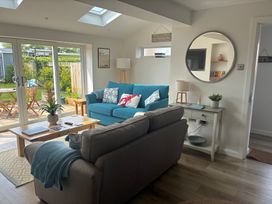 A living room with a sofa and coffee table at The Nest in Beadnell