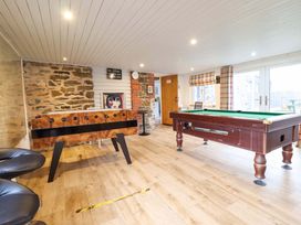 A snug with a foosball table and pool table at Bwthyn Y Bugail (Shepherd's Cottage) Pedairffordd near Llanrhaeadr-Ym-Mochnant