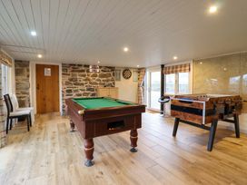 A recreation room with pool table and foosball table at Bwthyn Y Bugail (Shepherd's Cottage) Pedairffordd near Llanrhaeadr-Ym-Mochnant