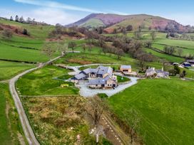A view of a property with garden and fields at Y Granar (The Granary) Llanrhaeadr-Ym-Mochnant