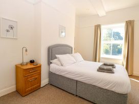 A bedroom with a bed and nightstand at Sunnymeade Buxton, Norfolk