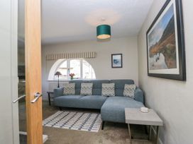 A living room with a sofa and coffee table at Windermere at the Graythwaite Estate near Hawkshead