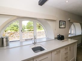 A kitchen with a sink and toaster at Windermere at the Graythwaite Estate near Hawkshead