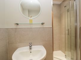 A bathroom with a sink and shower at Windermere at the Graythwaite Estate near Hawkshead
