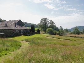 A building next to grassy fields at Windermere at the Graythwaite Estate Graythwaite Estate near Hawkshead