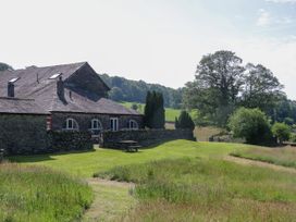 A building surrounded by grass and trees at Windermere at the Graythwaite Estate near Hawkshead