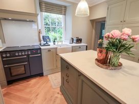 A kitchen with a stove and sink at High Torver House in Torver