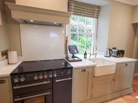A kitchen with a stove and sink at High Torver House in Torver
