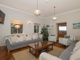 A living room with a sofa and Christmas tree at The Park in Ludlow