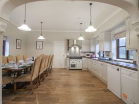 A kitchen with a dining table and chairs at The Park in Ludlow