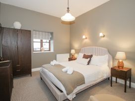 A bedroom with a bed and nightstands at The Park in Ludlow