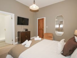 A bedroom with a bed and a television at The Park in Ludlow