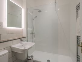 A bathroom with a shower, sink and toilet at The Park in Ludlow
