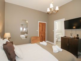 A bedroom with a bed and television at The Park in Ludlow