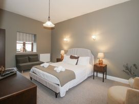 A bedroom with a bed and sofa at The Park in Ludlow