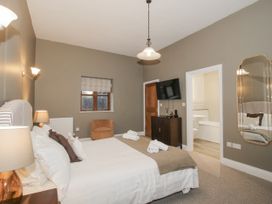 A bedroom with a bed and television at The Park in Ludlow