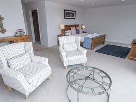 A living room with chairs and a coffee table at Atlantic View in Germoe