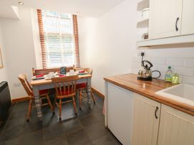 A kitchen with a dining table and chairs at Chapel Cottage Sandford, Cumbria