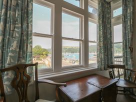 A living room with window view overlooking the harbor at 2 York House Dartmouth
