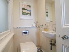 A bathroom with a toilet and sink at 2 York House in Dartmouth
