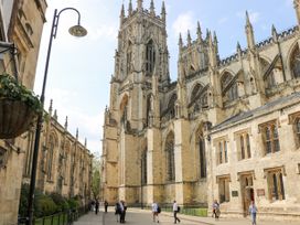 A street view of a large cathedral with gothic architecture and people walking nearby at 202 Salisbury Terrace in York