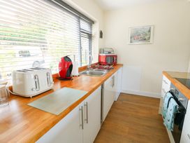 A kitchen with a toaster and kettle at Daisy Cottage in Benllech