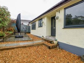 A front entrance with garden furniture at Daisy Cottage Benllech