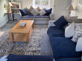 A living room with sofas and a coffee table at Fistral Bay Cottage Newquay