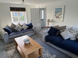 A living room with two sofas and a coffee table at Fistral Bay Cottage in Newquay