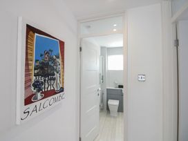 A bathroom with a toilet and sink at Little Starboard in Kingsbridge