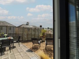 An outdoor area with a table and chairs at Little Starboard in Kingsbridge