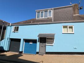 A house with blue exterior and garage door at 21 Above Town in Dartmouth