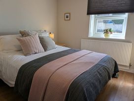 A bedroom with a bed and window at Melita in Curry Rivel