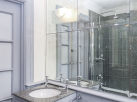 A bathroom with a sink and shower at Lion House in Moretonhampstead