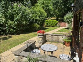 A garden with a table and chairs at Claire Cottage, Gateforth near Hambleton, North Yorkshire