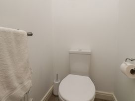 A bathroom with a toilet and towel rail at Buck Place The Bay - Filey