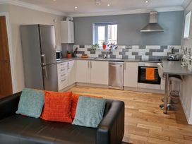 A kitchen with modern appliances and seating at Bryn in Bethesda