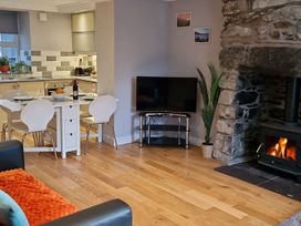 A living room with a dining area and fireplace at Annest in Bethesda