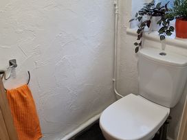A bathroom with a toilet and towel at Annest in Bethesda