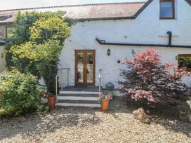 An entrance with steps and plants at Stable Cottage, Templeton near Narberth